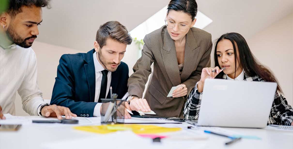 Business team working together at a desk.