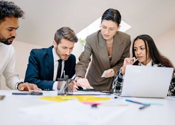 Business team working together at a desk.