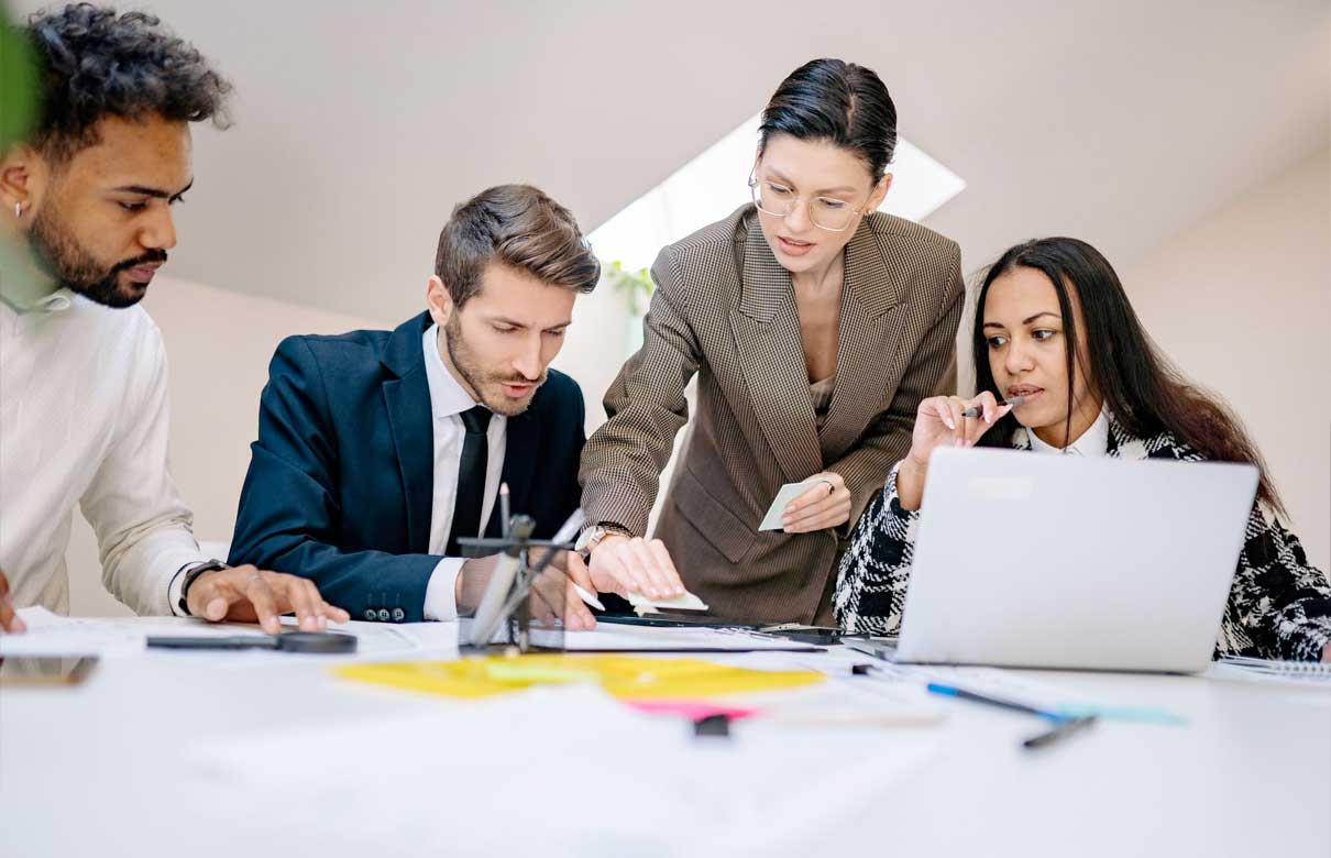 Business team working together at a desk.