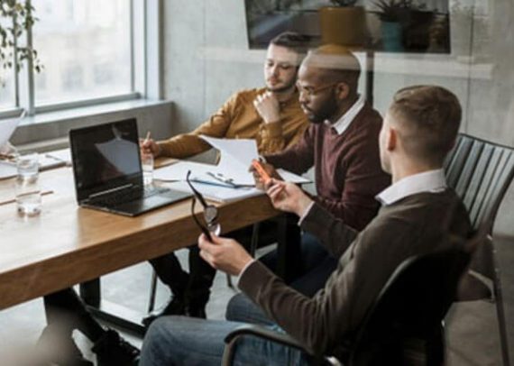 Four people collaborating around a table.