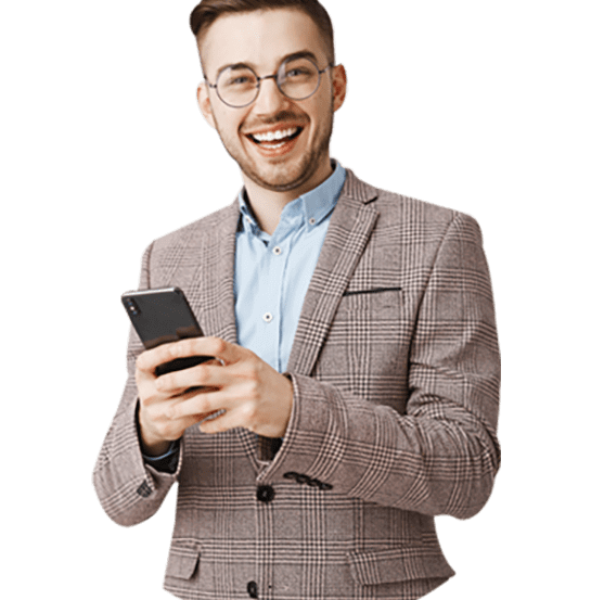 Smiling man in suit using phone.